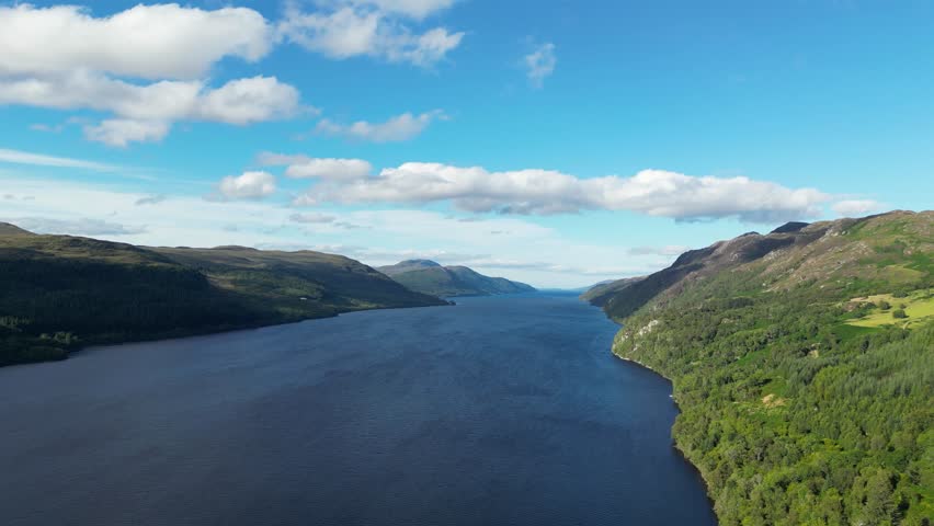 A beautiful shot of the Loch Ness Lake and nearby hills in Scotland