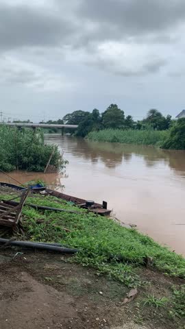 The river has a lot of water from the rain.