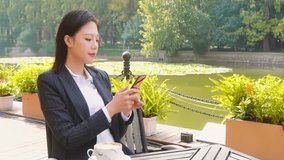 Portrait of a successful, Positive businesswoman reading newspaper and drinking coffee while relaxing outside office building - Powered by Shutterstock - Get 15% off with code: PIKWIZARD15