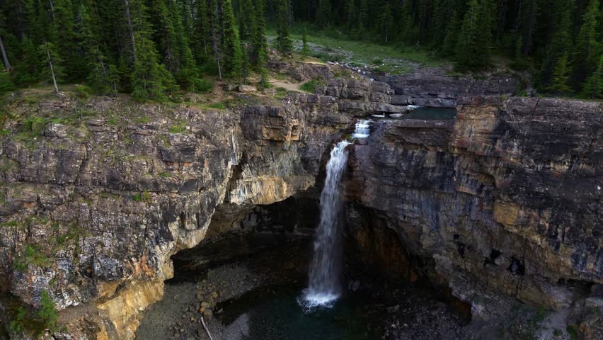 Ruby Falls Waterfall and Gorgeous Rocky Mountain Range outside Jasper National Park in Alberta Canada