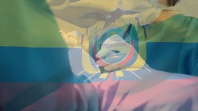 Animation of flag of ecuador over caucasian surgeons wearing face masks. Medicine, patriotism and digital interface concept digitally generated video. - Powered by Shutterstock - Get 15% off with code: PIKWIZARD15