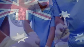Animation of flag of australia over diverse surgeons during surgery. Medicine, patriotism and digital interface concept digitally generated video. - Powered by Shutterstock - Get 15% off with code: PIKWIZARD15