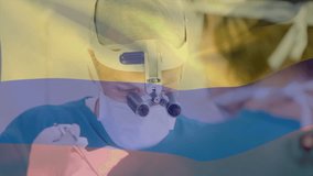 Animation of flag of colombia over caucasian surgeons during surgery. Medicine, patriotism and digital interface concept digitally generated video. - Powered by Shutterstock - Get 15% off with code: PIKWIZARD15
