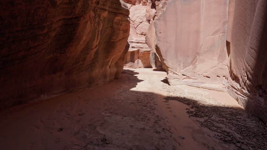 A very narrow aisle and walkway in the middle of the huge rocks of the canyon