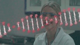 Animation of dna strand over caucasian female scientist working in lab. Global medicine, science and digital interface concept digitally generated video. - Powered by Shutterstock - Get 15% off with code: PIKWIZARD15