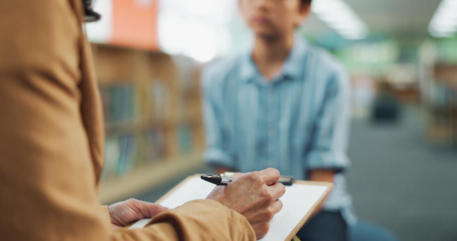 Therapy, clipboard and school counselor with student for adhd test with psychology chart at academy. Consultation, help and educational therapist with child for learning challenge, autism or dyslexia