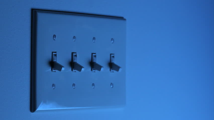 HD video of multiple light switches being turned on and off, one at a time, with