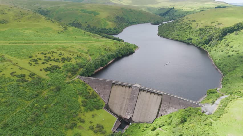Aerial flyover of Meldon Reservoir in Dartmoor National Park highlighting its expansive natural beauty