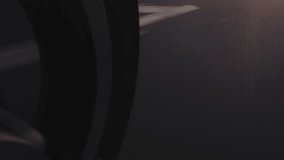 POV low angle camera on scooter motorcycle driving around city road sign traffic at night  - Powered by Shutterstock - Get 15% off with code: PIKWIZARD15