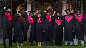 Happy Indian students and portrait at graduation with celebration, friends and graduate group outdoor with a smile. Friends wearing traditional academic gown, cap celebrate academic achievement event. - Powered by Shutterstock - Get 15% off with code: PIKWIZARD15