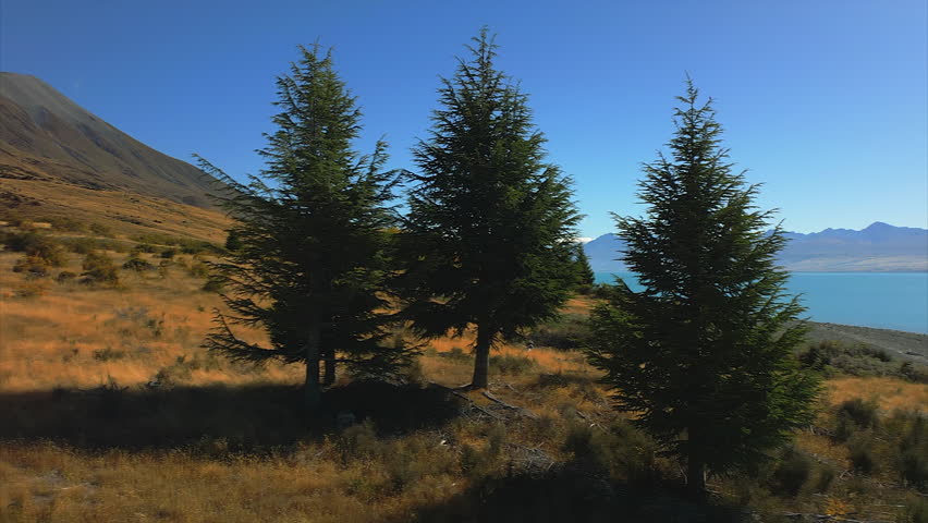 Highlands above Lake Pukaki, New Zealand looking towards Mount Cook, Aoraki, New Zealand - sliding aerial reveal