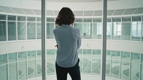 Calling businesswoman discussing work near office window closeup. Serious woman executive talking smartphone standing empty hallway. Corporate executive having cellphone conversation in corridor. - Powered by Shutterstock - Get 15% off with code: PIKWIZARD15