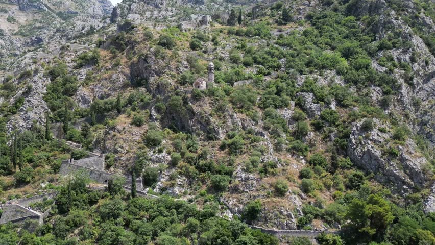 An aerial view of a greeb hill over Kotor, Montenegro