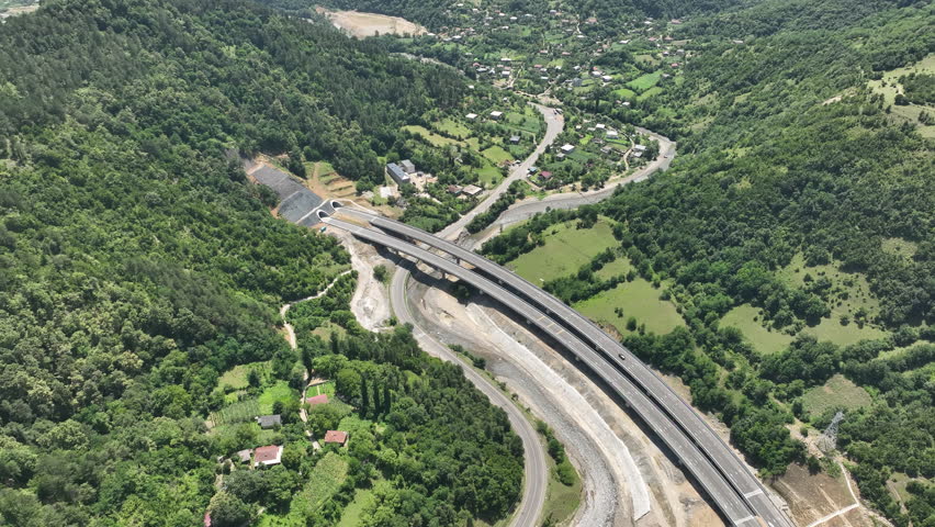 Aerial view of new road through Rikoti pass. Drone shot above highway in mountains of Georgia 2024 summer