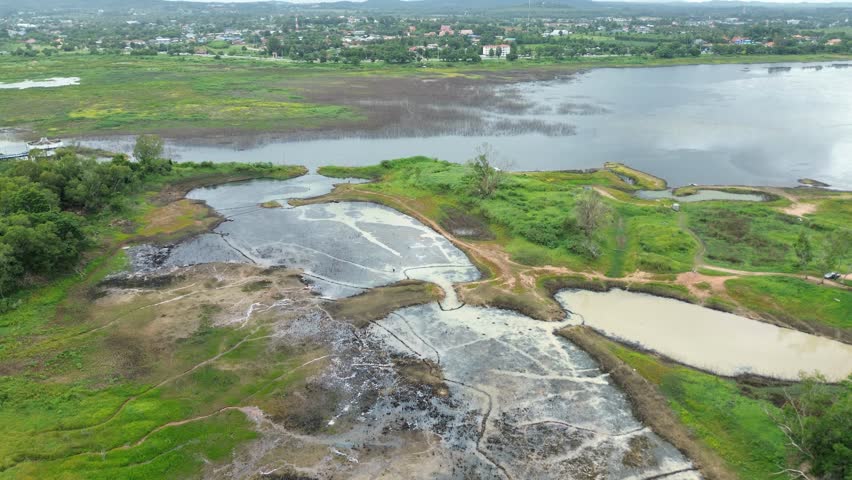 Exploring An Abandoned Oil Extraction Site Surrounded By Lush Vegetation