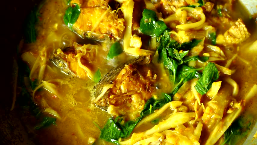 Cooking Thai fish with bamboo shoot curry , in door Chiangmai Thailand.