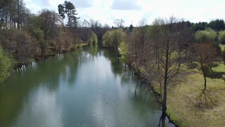 A drone view of a river floating in the park