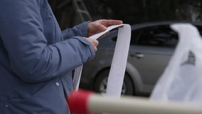 Financial crisis, Grocery Shopping. A woman checks grocery prices in a receipt from a supermarket. High food prices  - Powered by Shutterstock - Get 15% off with code: PIKWIZARD15