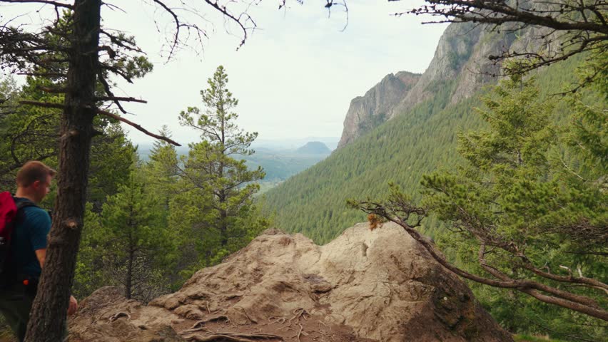 A tourist enjoying the view of Mount Little Si in Washington, USA