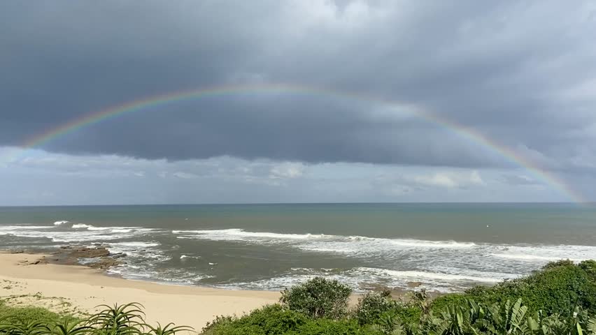 A beautiful view of the rainbow over the ocean