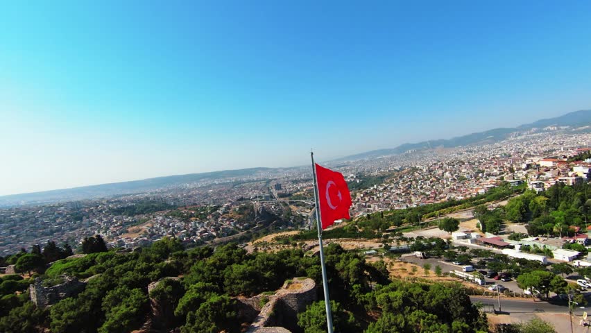 Shooting of the Turkish flag waving in Izmir city with a drone