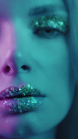 Close up is a beautiful blonde girl in a neon studio, dressed in a shirt. Beauty portrait of a woman