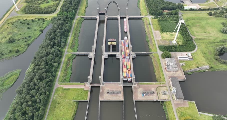 Aerial top down view on the Kreekraksluizen twin locks located in the Scheldt-Rhine Canal in Reimerswaal, Zeeland. Ships passing through.