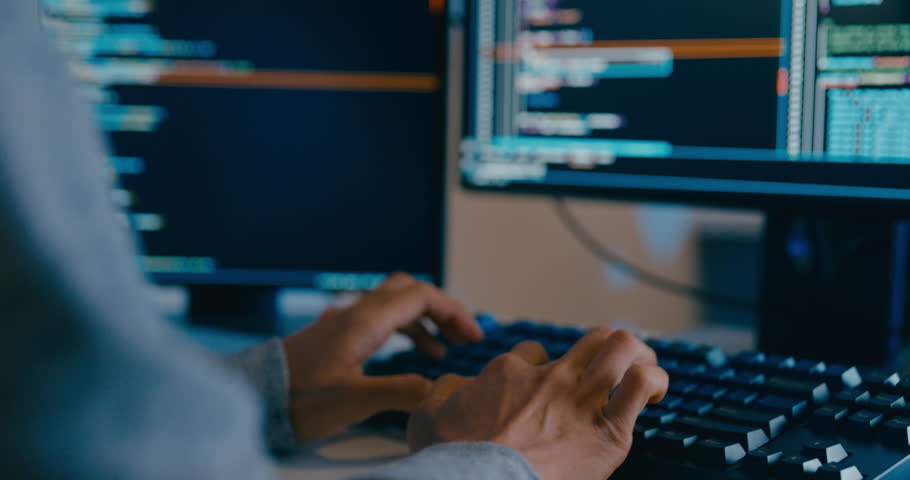 Closeup young adult Asia male freelance typing write prompt AI bot IT app smart program nomad, video game, terminal with coding language, designer, big data center on desktop computer in night office.