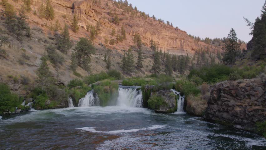 Steelhead Falls in Central Oregon. Beautiful waterfall in river with high desert canyon walls. 60fps, 4k.