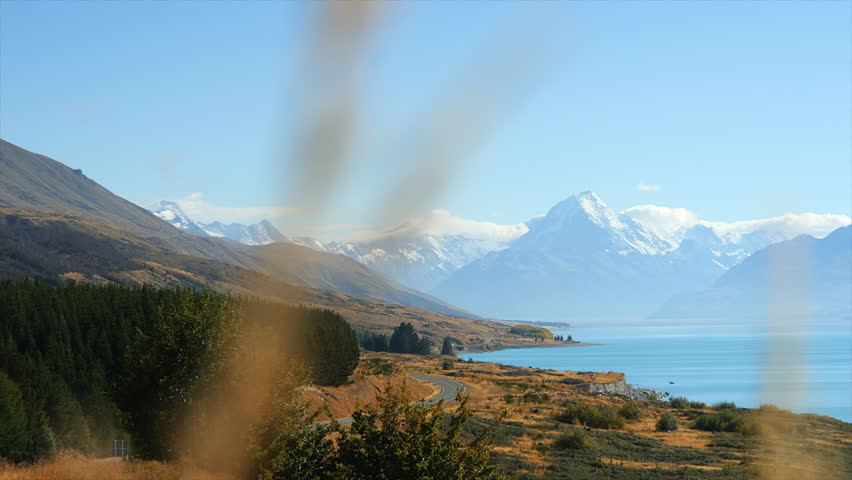 Lake Pukaki and Mount Cook Aoraki, New Zealand - sliding view from a grassy overlook