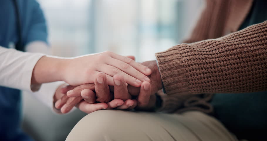 Senior care, nurse and holding hands for healthcare, support and wellness on sofa with empathy. Elderly person, caregiver and healing for mental health with geriatric worker, hope and communication