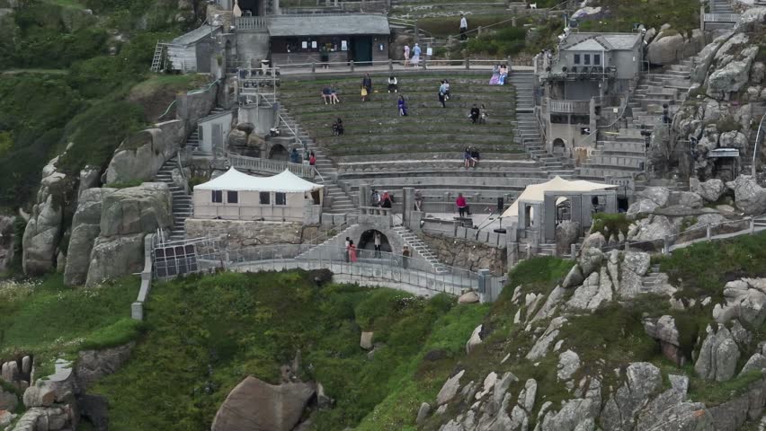 Aerial static shot of the famous Minack Theatre carved into the side of a cliff