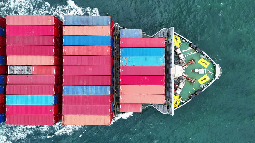 Top view of Cargo container ship carrying container and running in international container port customs shipyard sea port concept smart logistic service. side Container Ship.