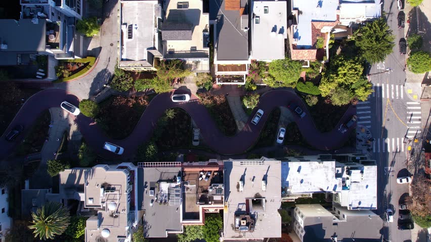 Lombard Street, San Francisco USA. Top Down Aerial View of Traffic on Famous Curvy Road on Sunny Day
