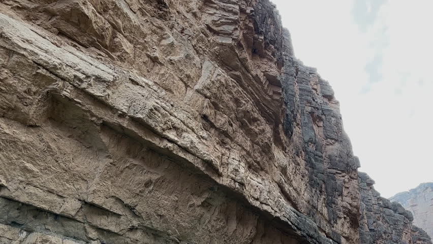 Woman in Rio Grande River Under Cliffs of Santa Elena Canyon, Big Bend National Park, Texas USA
