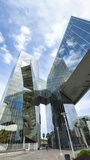 barcelona mirrored glass skyscraper with reflections of clouds in the sky in vertical - Powered by Shutterstock - Get 15% off with code: PIKWIZARD15