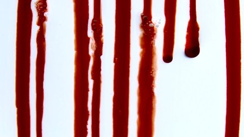 Blood Lines.  Smearing lines of blood running down a bluish-white fluid surface.