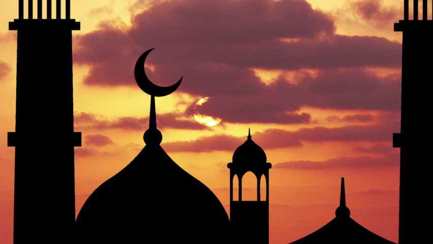 Silhouette of a mosque on a background of sunrise.