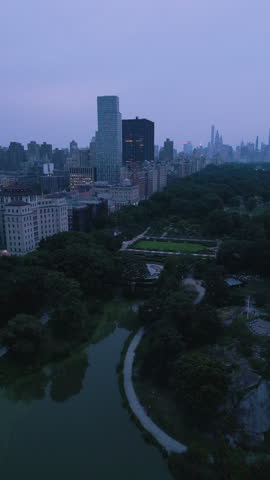Vertical 4K Aerial Drone City At Dusk Gloomy NYC Buildings Central Park