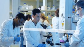 Animation of dna strand and chemical formula over diverse scientists doing experiment. Technology, science and digital interface concept digitally generated video. - Powered by Shutterstock - Get 15% off with code: PIKWIZARD15