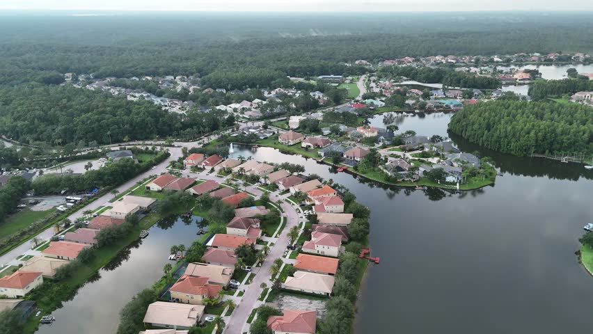 An aerial view of San Marco Island with residential mansions under a blue sky in Miami, Florida, USA