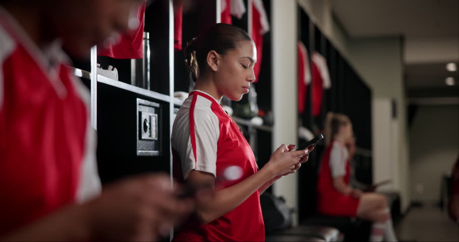 Sport, woman and phone in locker room for text, social media and check training schedule. Football player, girl and type on mobile for transport app, networking and favorite soccer team update