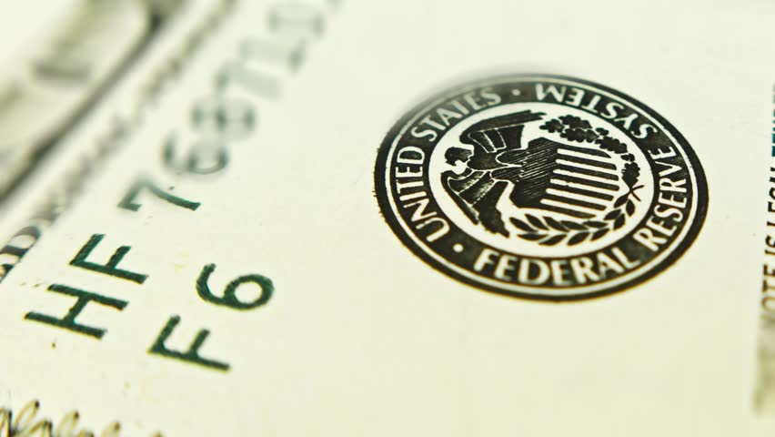 US Federal Reserve System stamp on a One hundred dollars bill, macro shooting selective focus