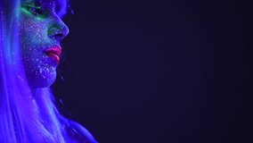 Fashion model dancing woman in neon light, beautiful model girl colorful bright fluorescent make-up, painted skin, Body Art design, disco female in UV, colorful make up. Night club. Slow motion  - Powered by Shutterstock - Get 15% off with code: PIKWIZARD15