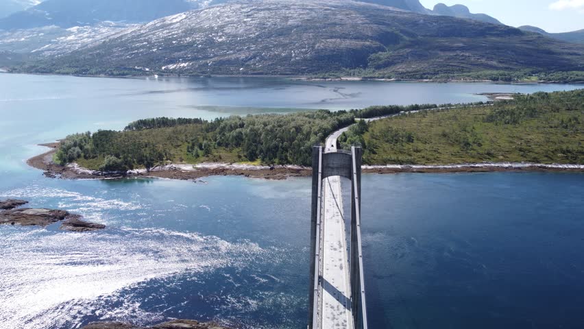 Aerial drone top view of bridge in Northen Norway with cars driving on top 