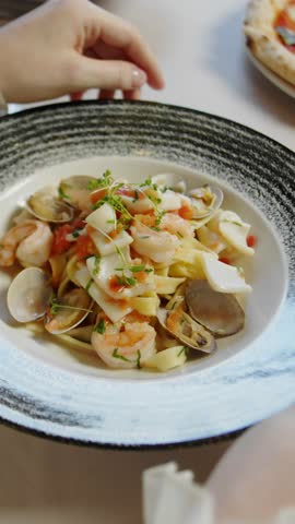Pasta with shrimp and basil, noodles with seafood.