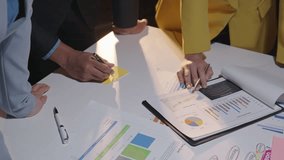 Business professionals collaborate on data analysis in an office meeting, highlighting teamwork and decision making - Powered by Shutterstock - Get 15% off with code: PIKWIZARD15