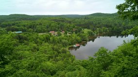 Flying along side a lake over forests and cottages during the summer. Taken in cottage country in rural Ontario, Canada - Powered by Shutterstock - Get 15% off with code: PIKWIZARD15