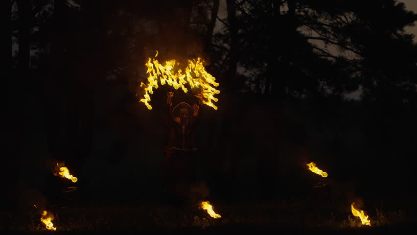 Fire Show In Forest In Night, Women In Folklore Gown Performing Tricks With Fire Torches, Slowmotion