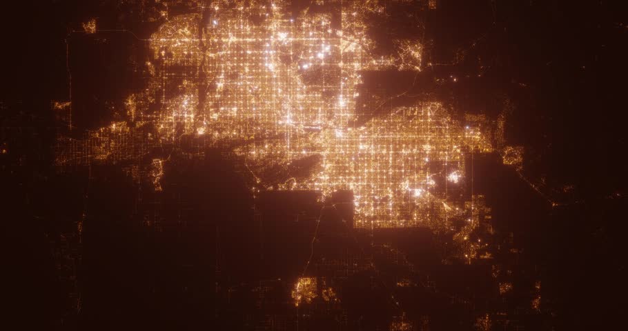 Phoenix (Arizona, USA) aerial view at night. Satellite view on modern city with street lights. Camera is flying above the city, moving forward